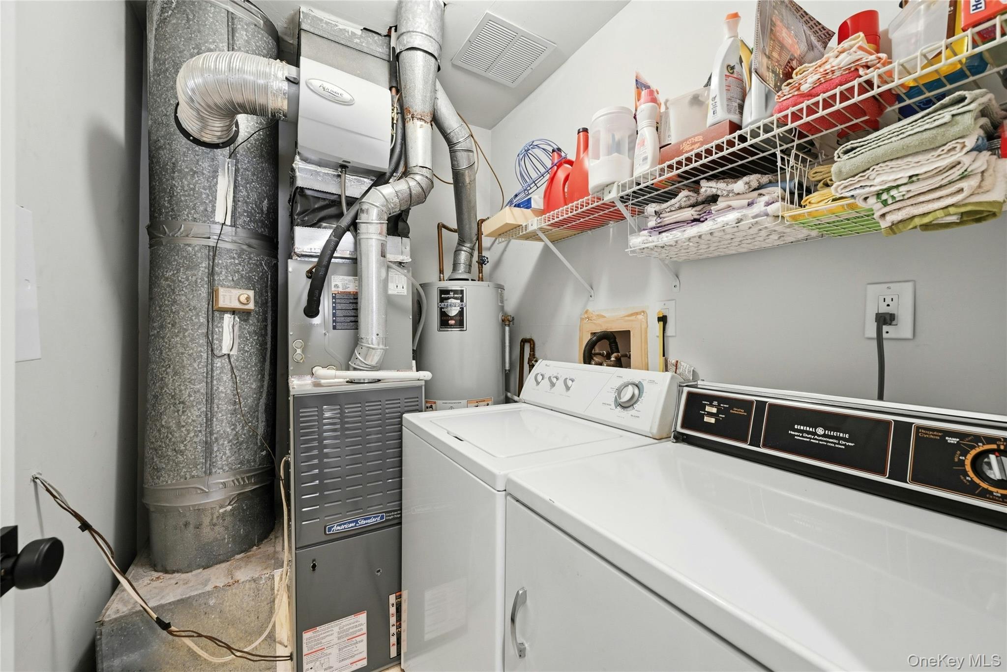 9 Baldwin Court, Unit 9 Ridge, NY 11961 - Photo 24 of 27 a utility room with dryer and washer