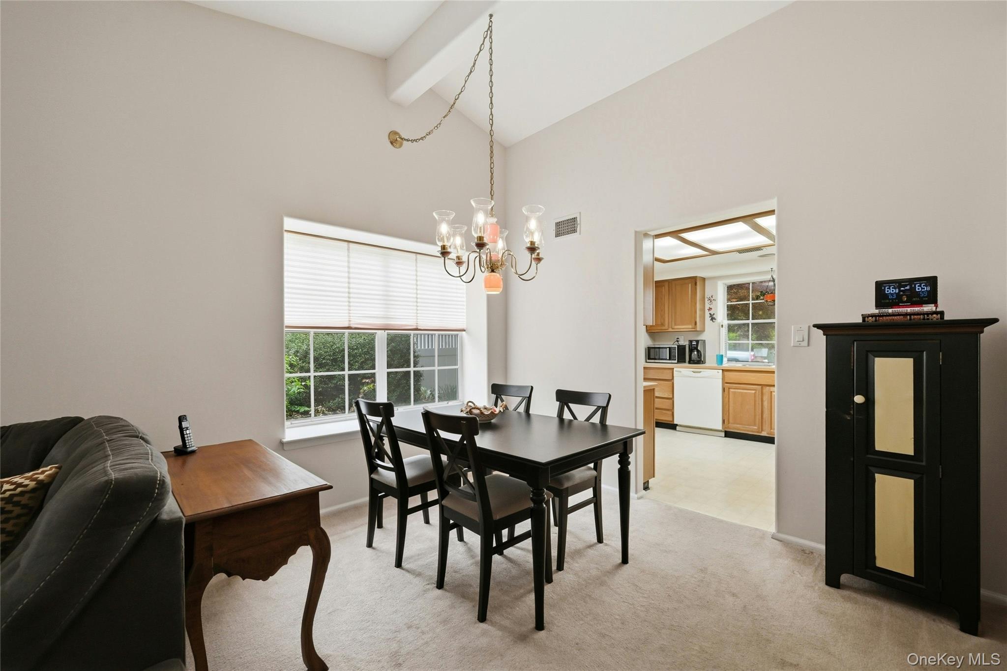 9 Baldwin Court, Unit 9 Ridge, NY 11961 - Photo 7 of 27 a view of a dining room with furniture window and outside view