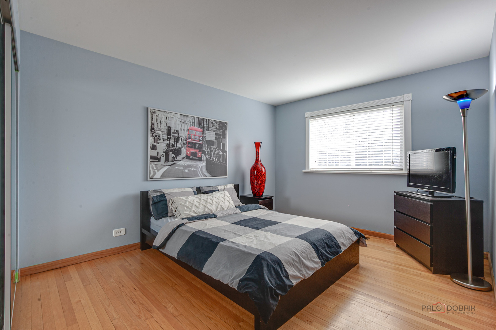 2016 Seneca Lane Mount Prospect, IL 60056 - Photo 18 of 33 a bedroom with a bed and a flat screen tv