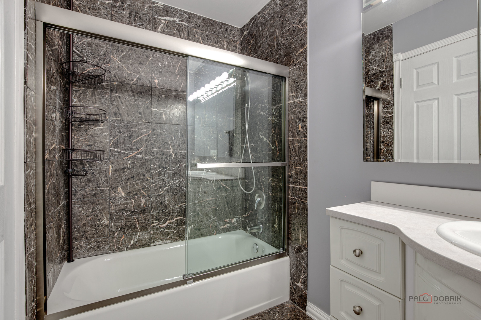 2016 Seneca Lane Mount Prospect, IL 60056 - Photo 19 of 33 a bathroom with a bathtub and a shower