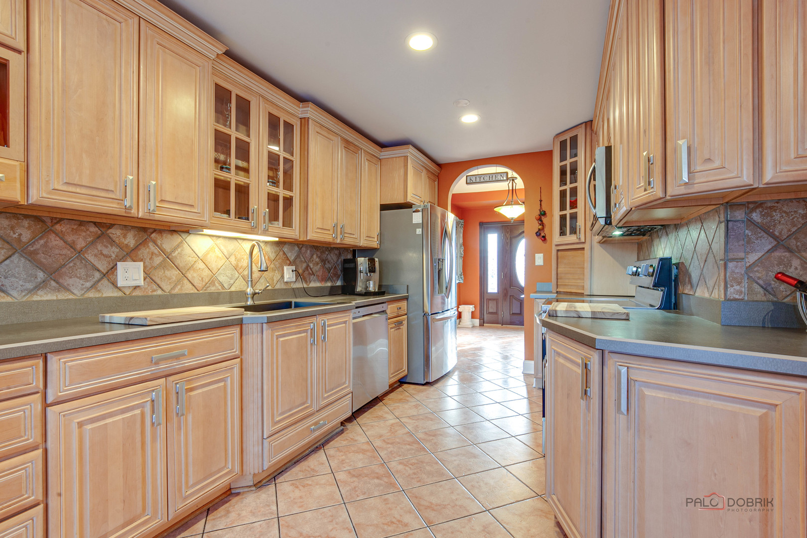 2016 Seneca Lane Mount Prospect, IL 60056 - Photo 6 of 33 a kitchen with granite countertop white cabinets and stainless steel appliances