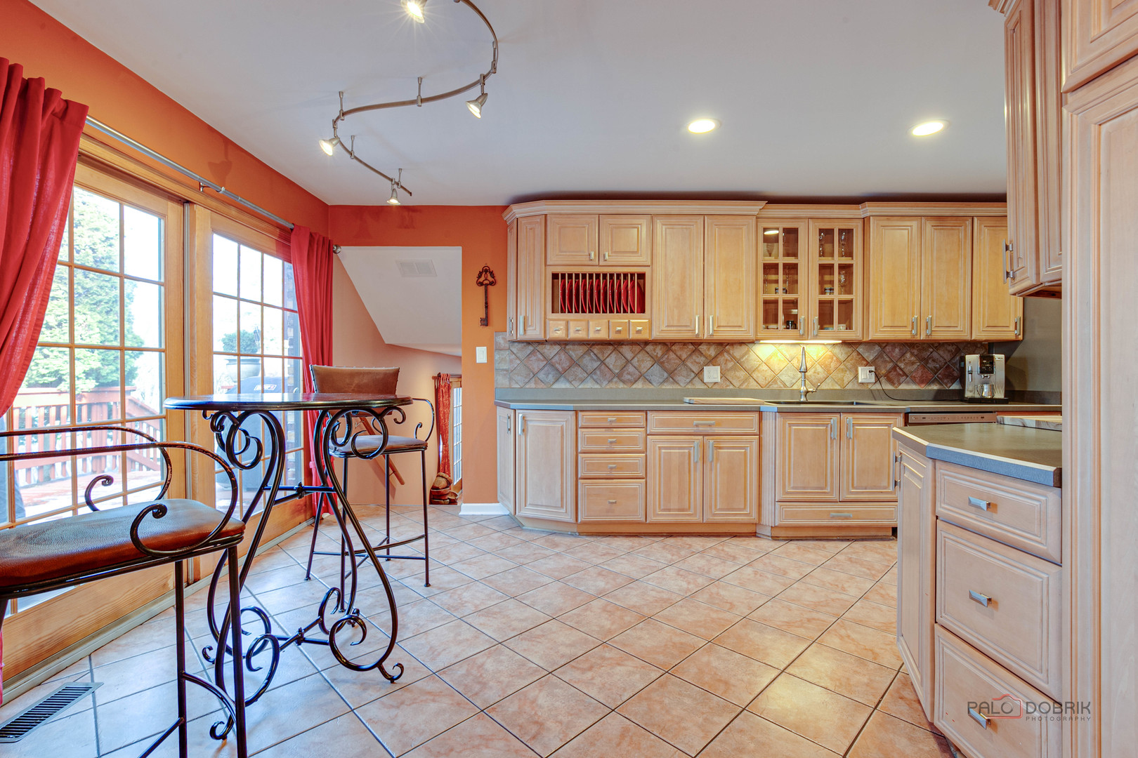 2016 Seneca Lane Mount Prospect, IL 60056 - Photo 9 of 33 a kitchen with granite countertop a table chairs stove and cabinets