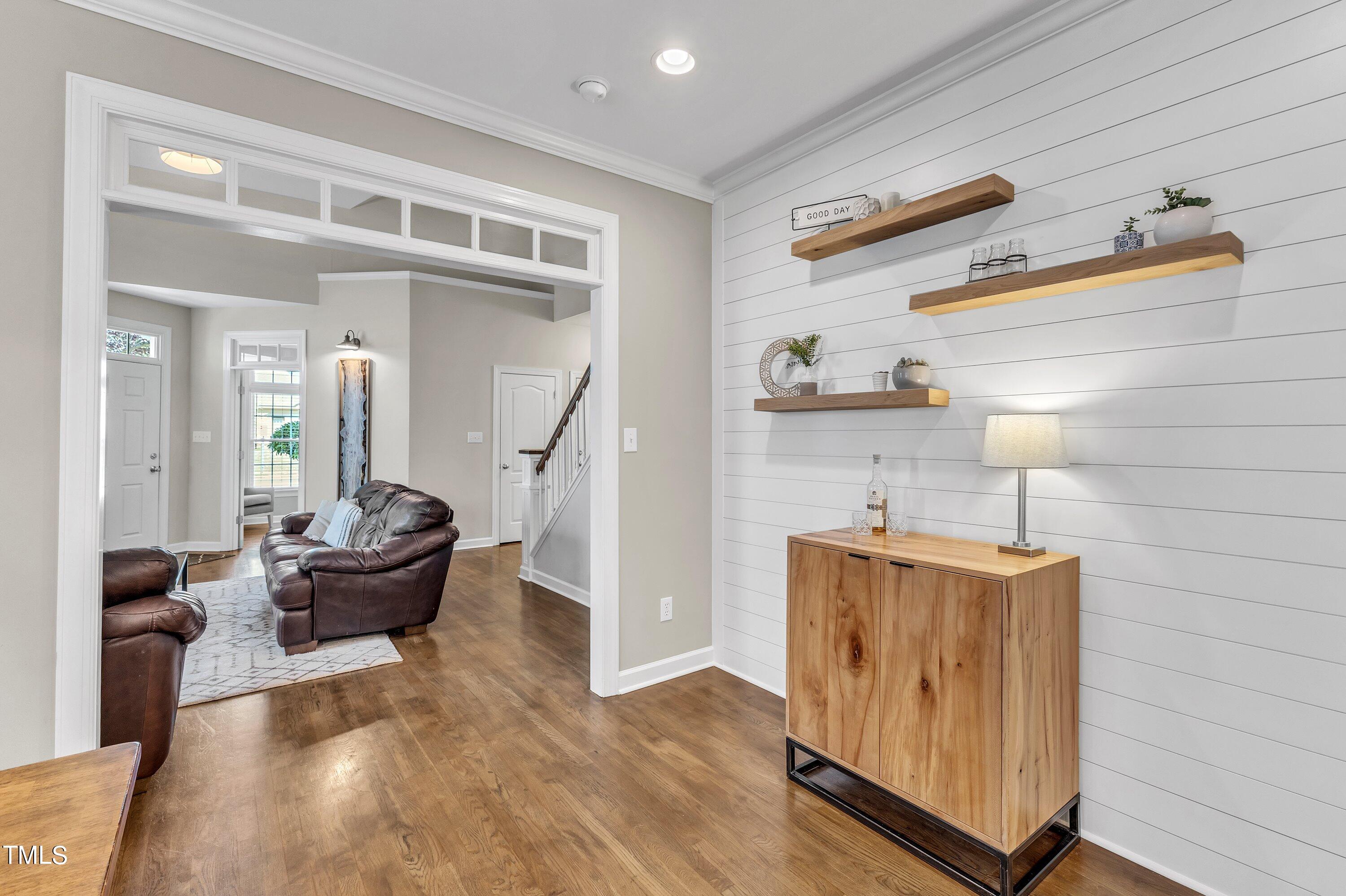 6323 Cedar Waters Drive Raleigh, NC 27607 - Photo 29 of 84 a living room with furniture and a wooden floor