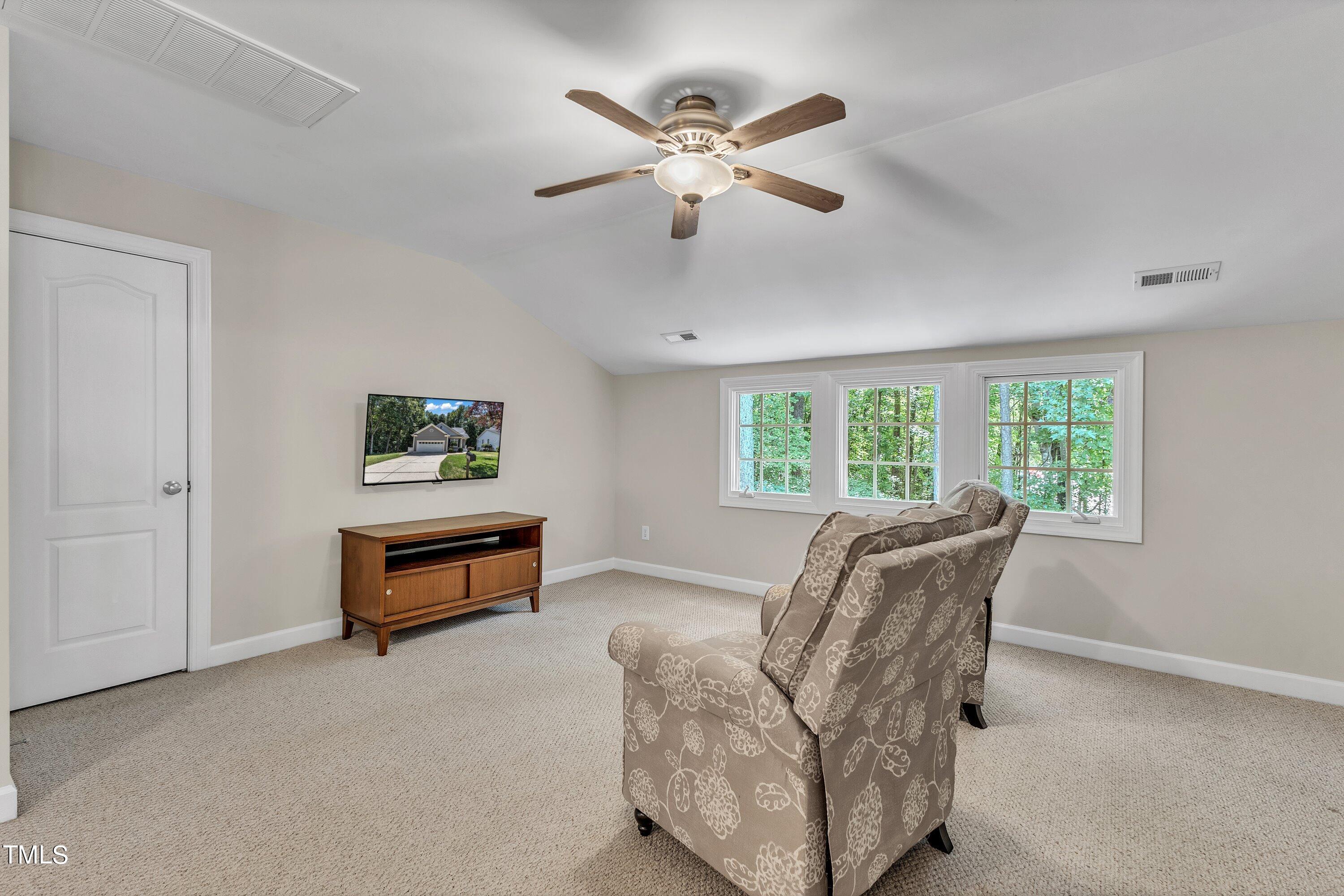 6323 Cedar Waters Drive Raleigh, NC 27607 - Photo 46 of 84 a living room with furniture and a window