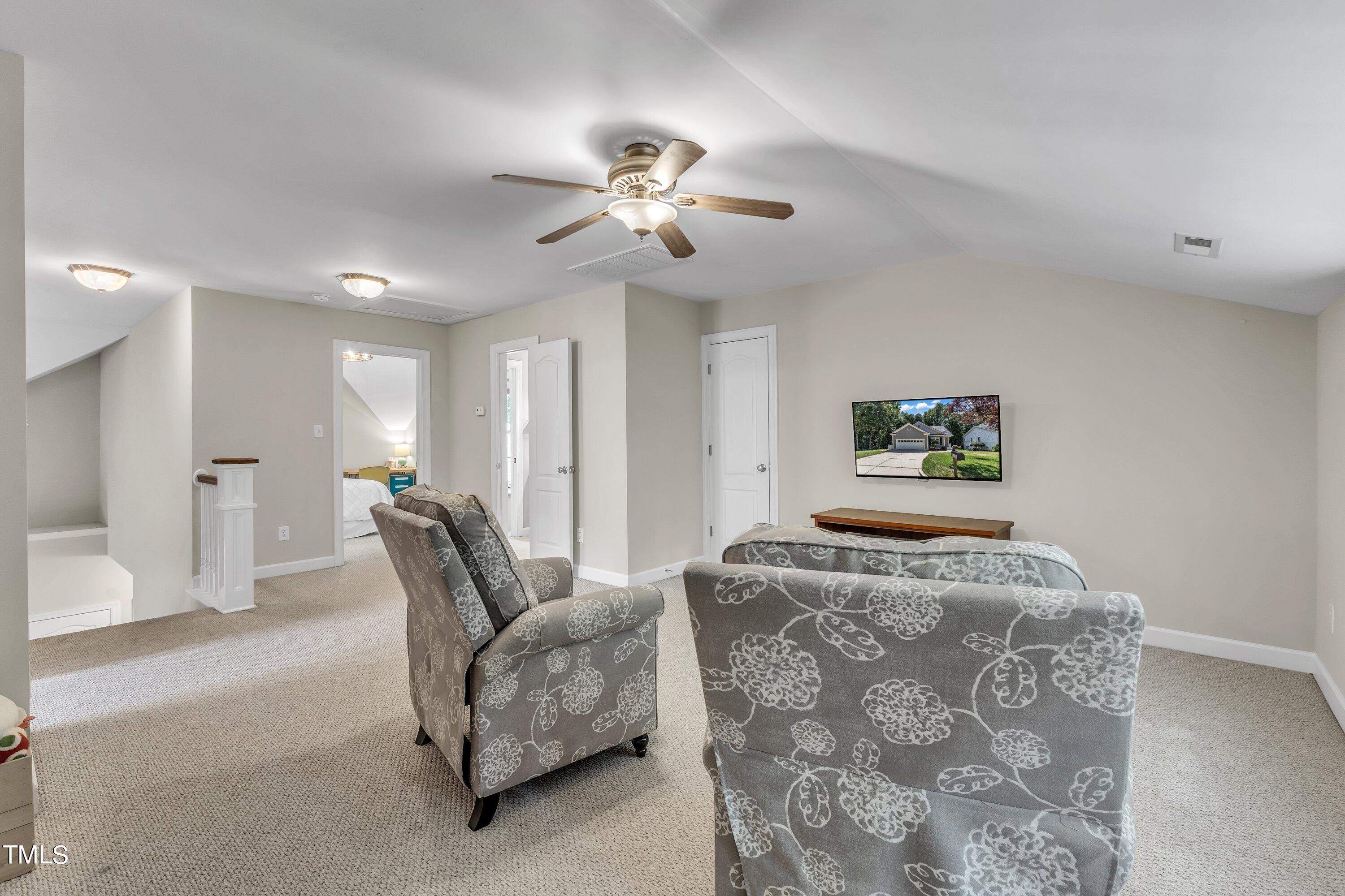 6323 Cedar Waters Drive Raleigh, NC 27607 - Photo 47 of 84 a living room with furniture and a chandelier