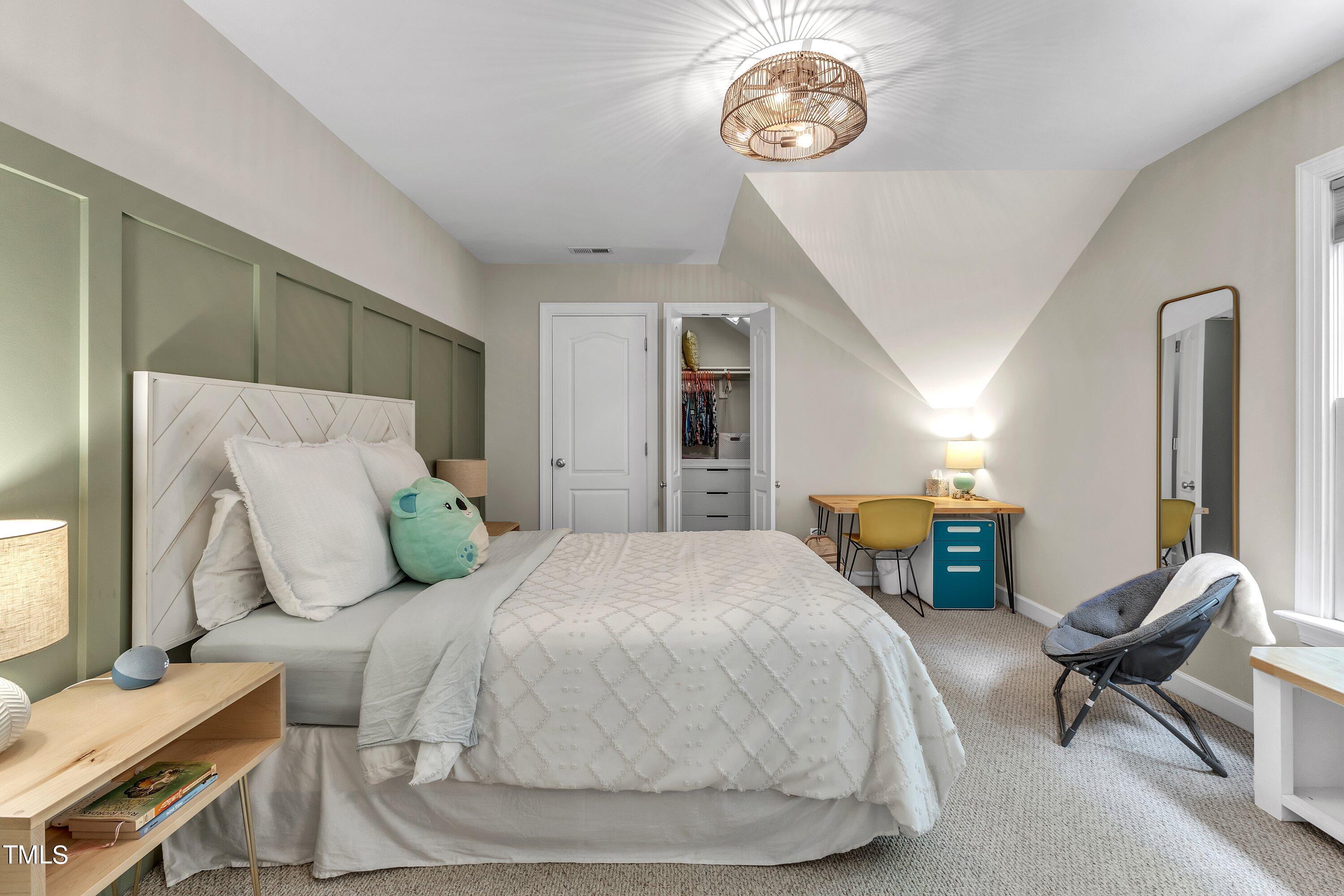 6323 Cedar Waters Drive Raleigh, NC 27607 - Photo 49 of 84 a bedroom with a bed and a chair in it