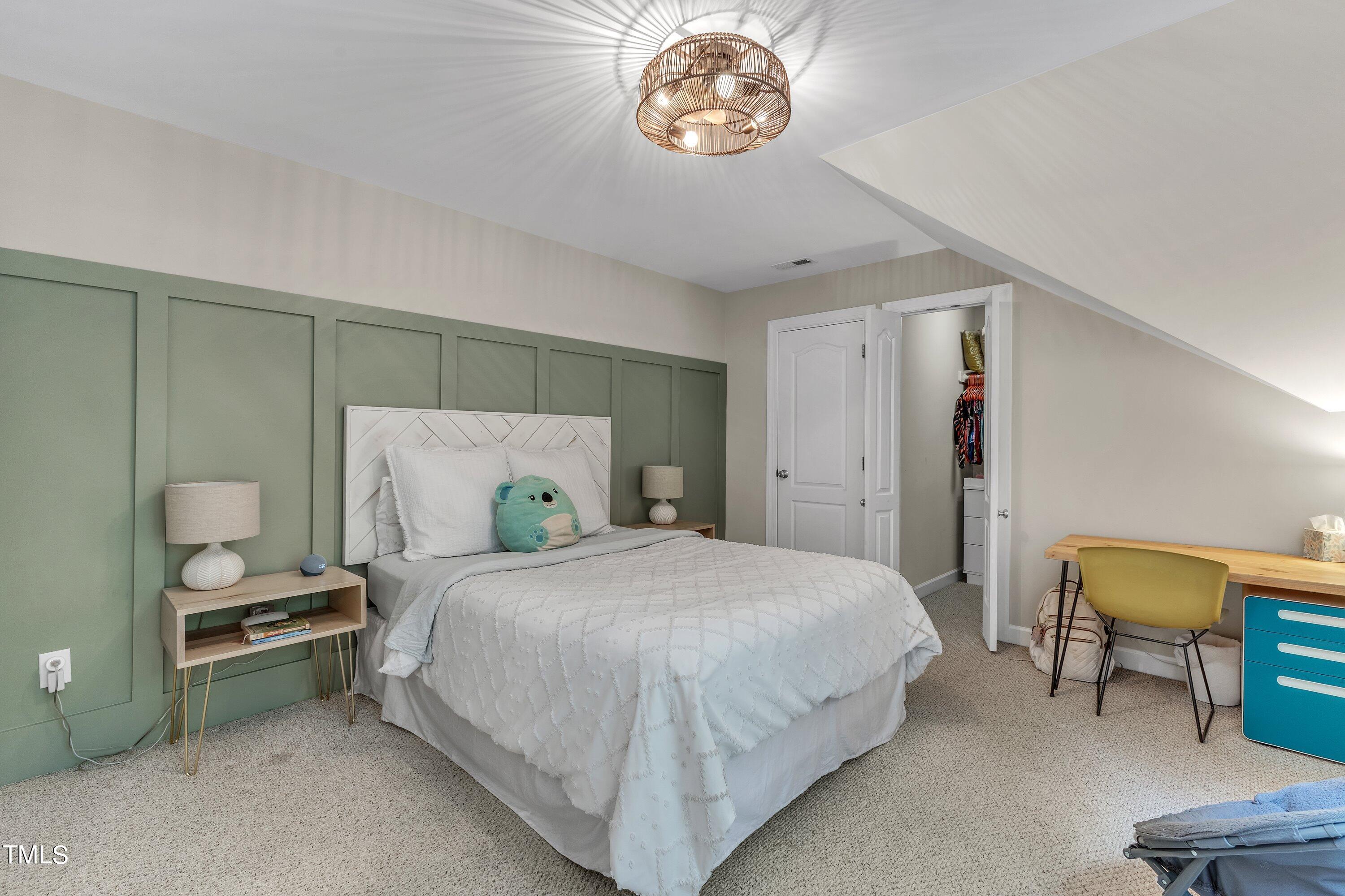 6323 Cedar Waters Drive Raleigh, NC 27607 - Photo 50 of 84 a bedroom with a bed and a table