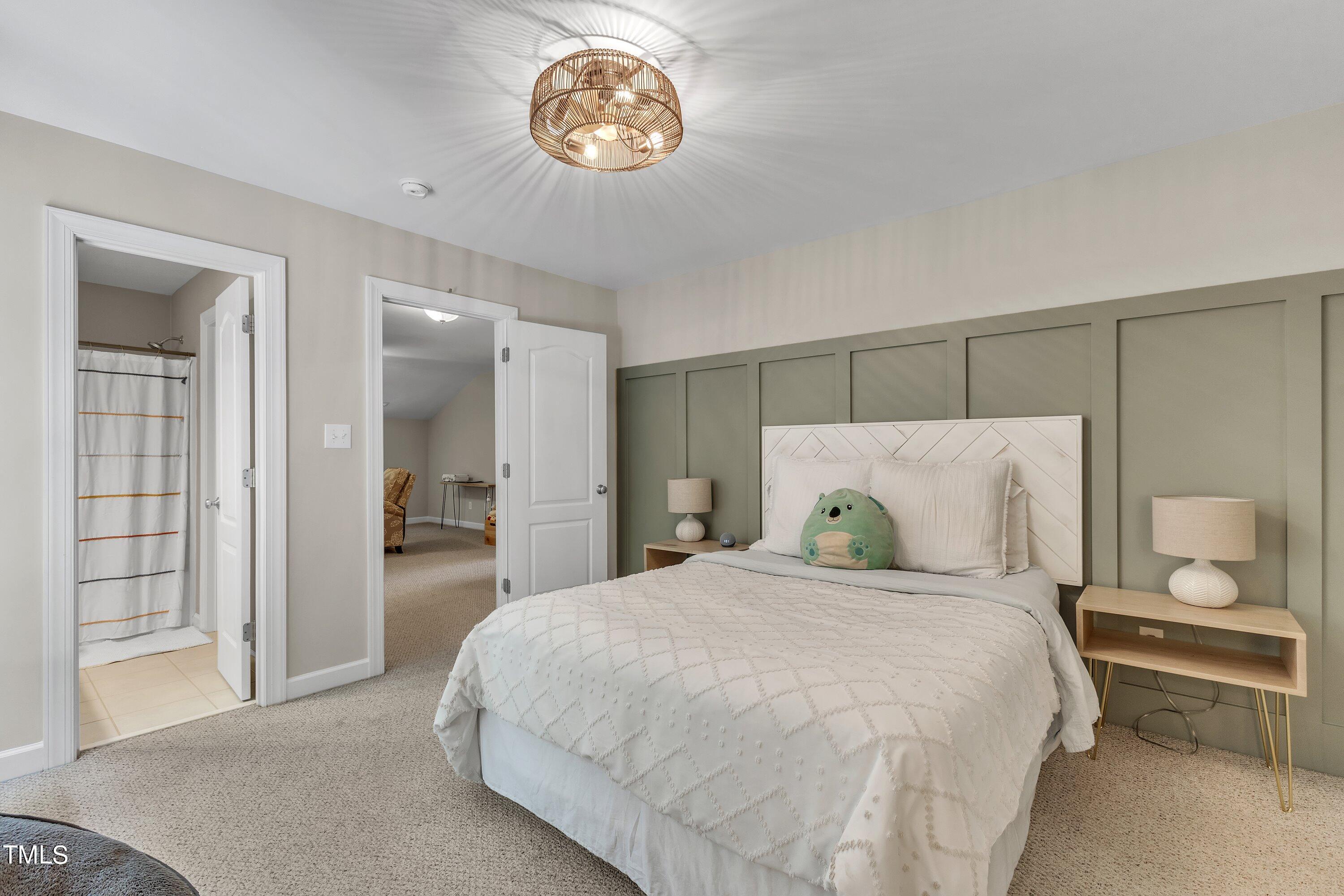 6323 Cedar Waters Drive Raleigh, NC 27607 - Photo 51 of 84 a bedroom with a bed and a table