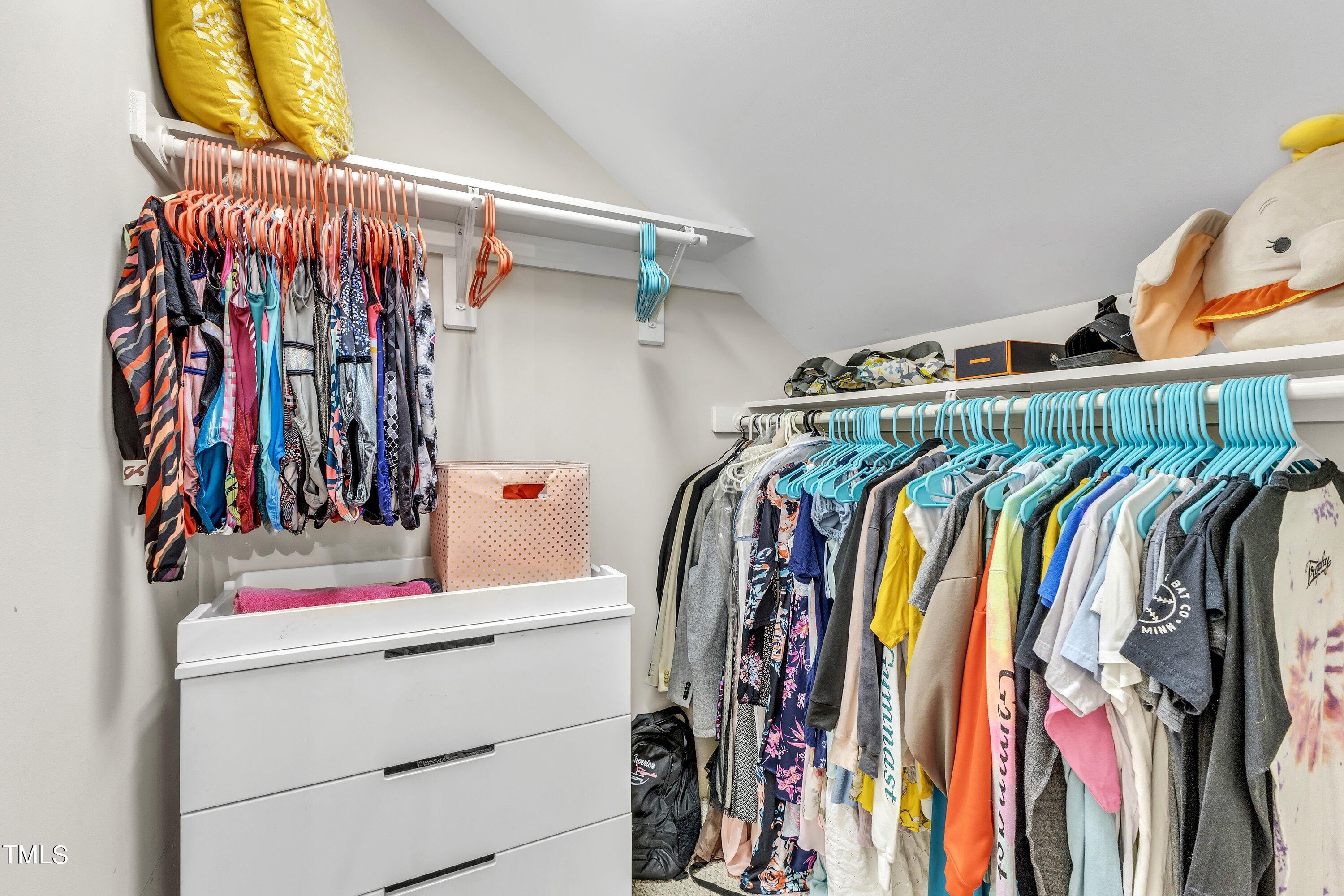 6323 Cedar Waters Drive Raleigh, NC 27607 - Photo 55 of 84 a view of walk in closet with clothes and shoes