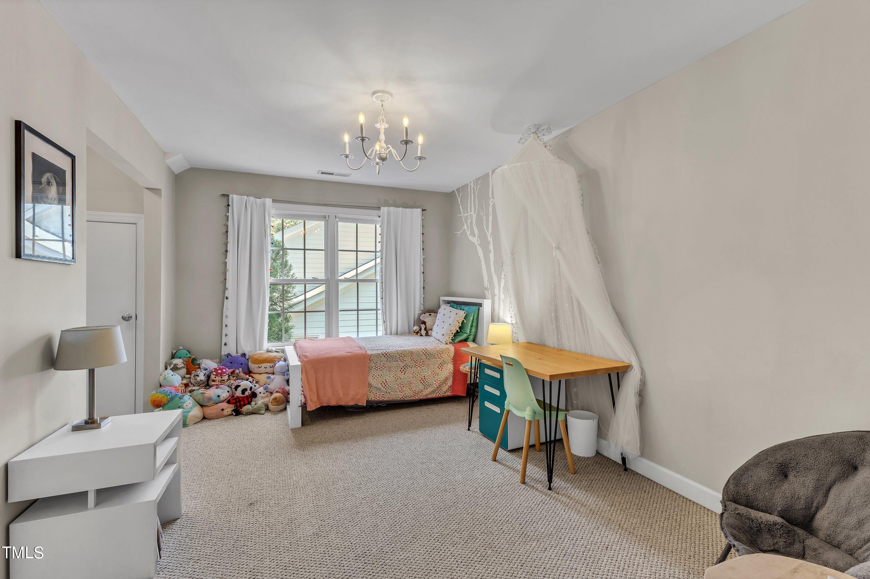 6323 Cedar Waters Drive Raleigh, NC 27607 - Photo 56 of 84 a bedroom with bed and a window