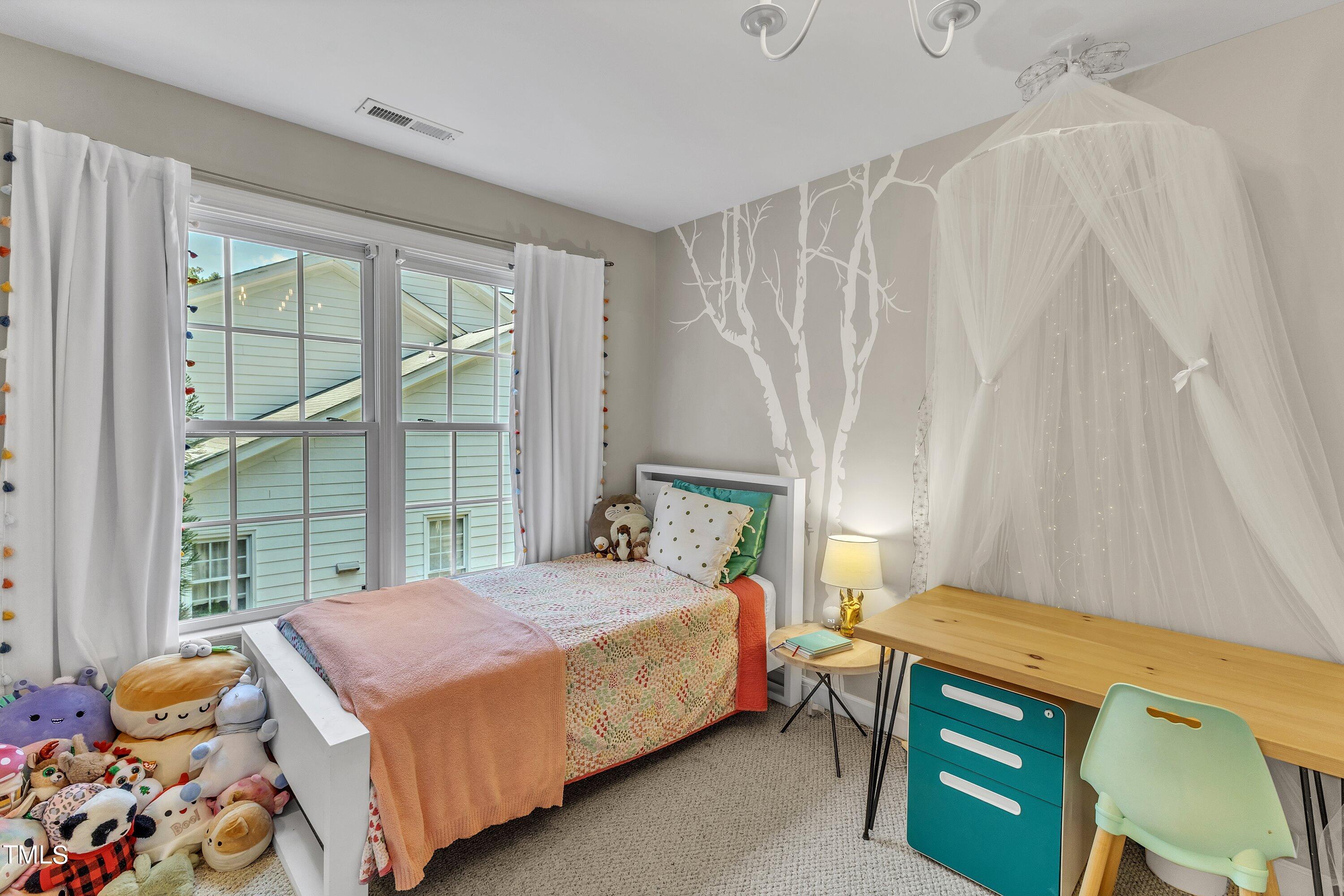 6323 Cedar Waters Drive Raleigh, NC 27607 - Photo 58 of 84 a bedroom with a bed and a window