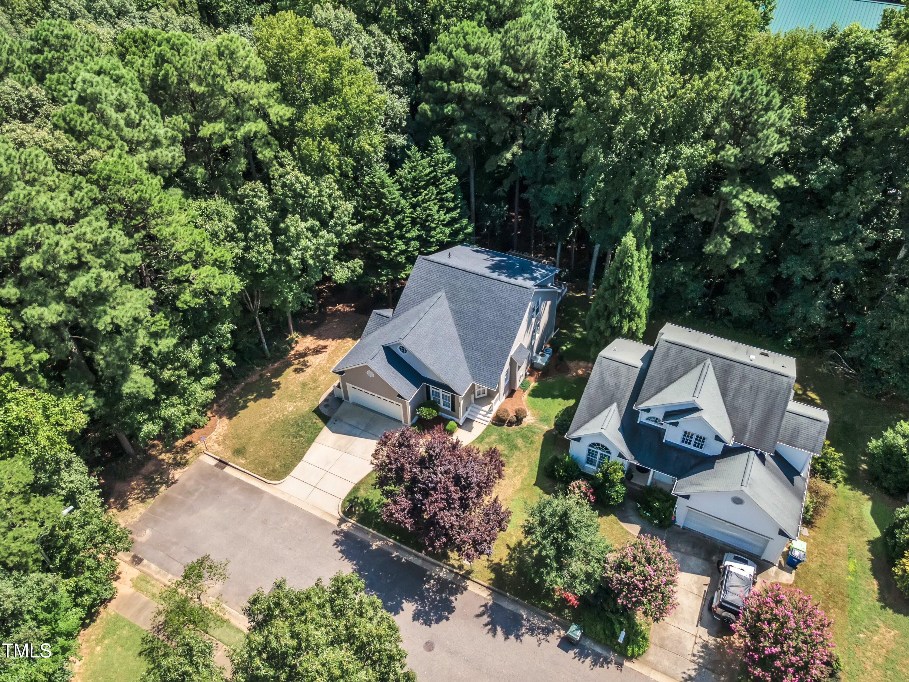6323 Cedar Waters Drive Raleigh, NC 27607 - Photo 74 of 84 an aerial view of a house with a garden