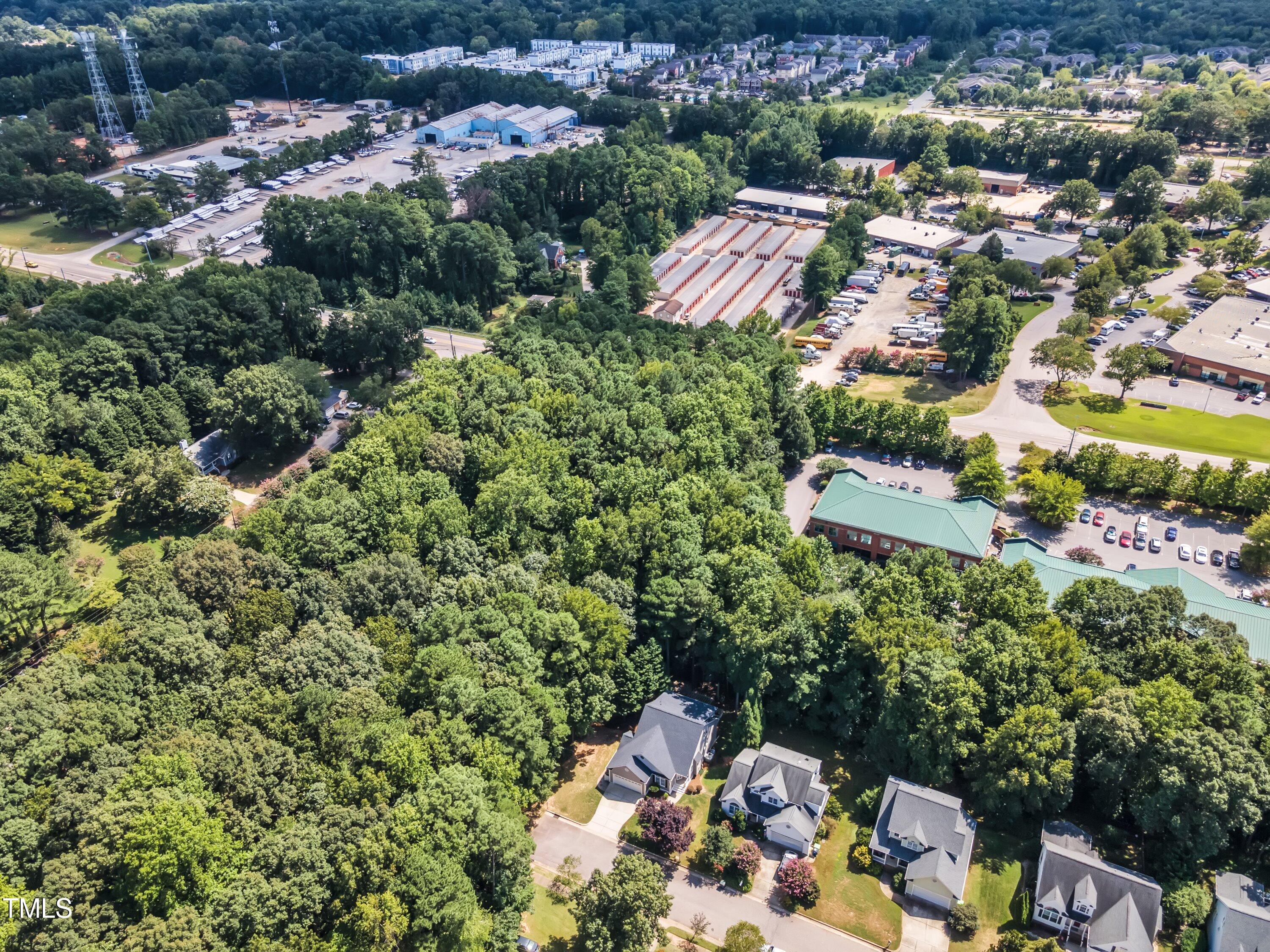 6323 Cedar Waters Drive Raleigh, NC 27607 - Photo 78 of 84 an aerial view of residential house with outdoor space and trees all around