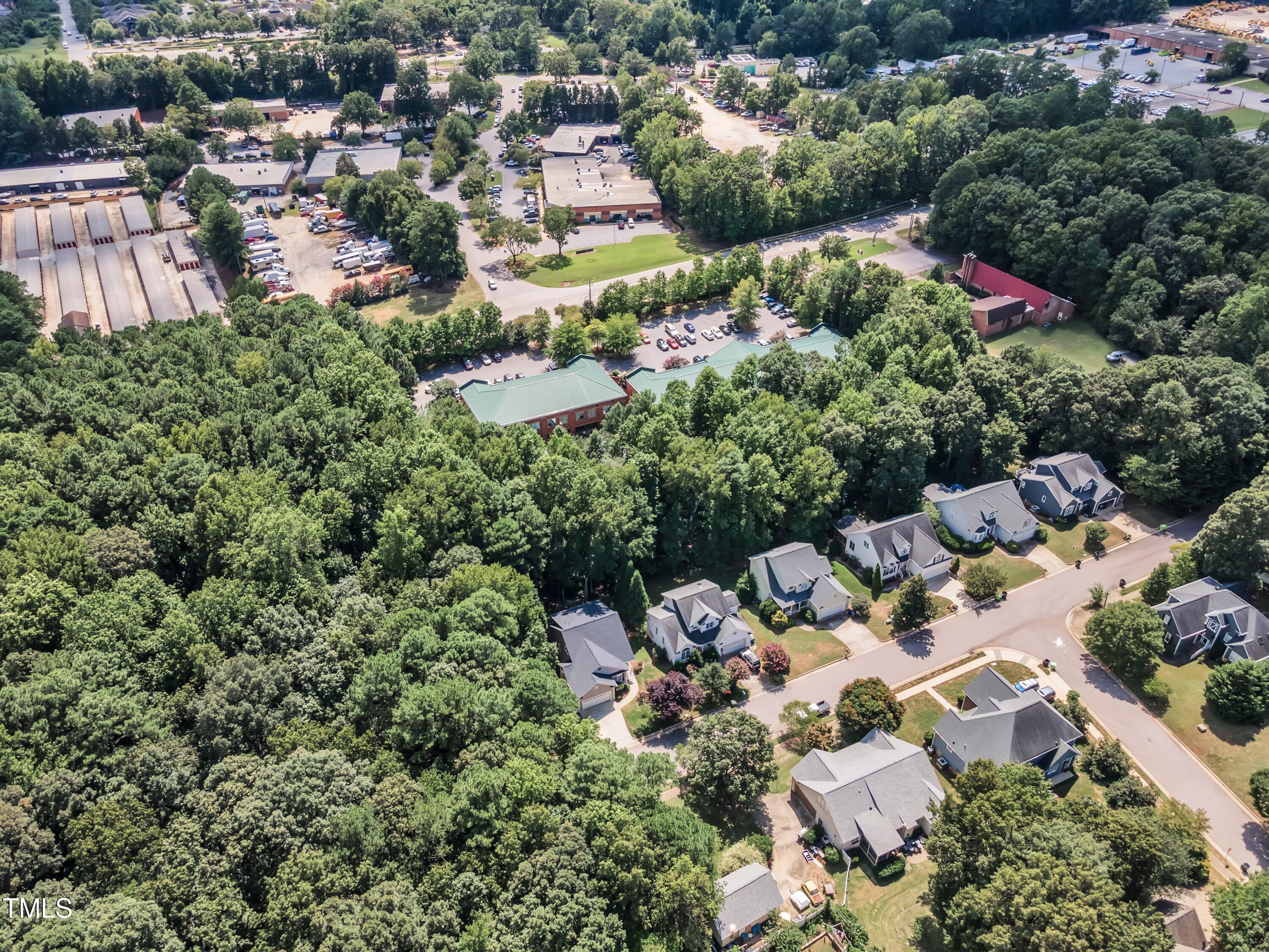 6323 Cedar Waters Drive Raleigh, NC 27607 - Photo 79 of 84 an aerial view of residential house with outdoor space and swimming pool