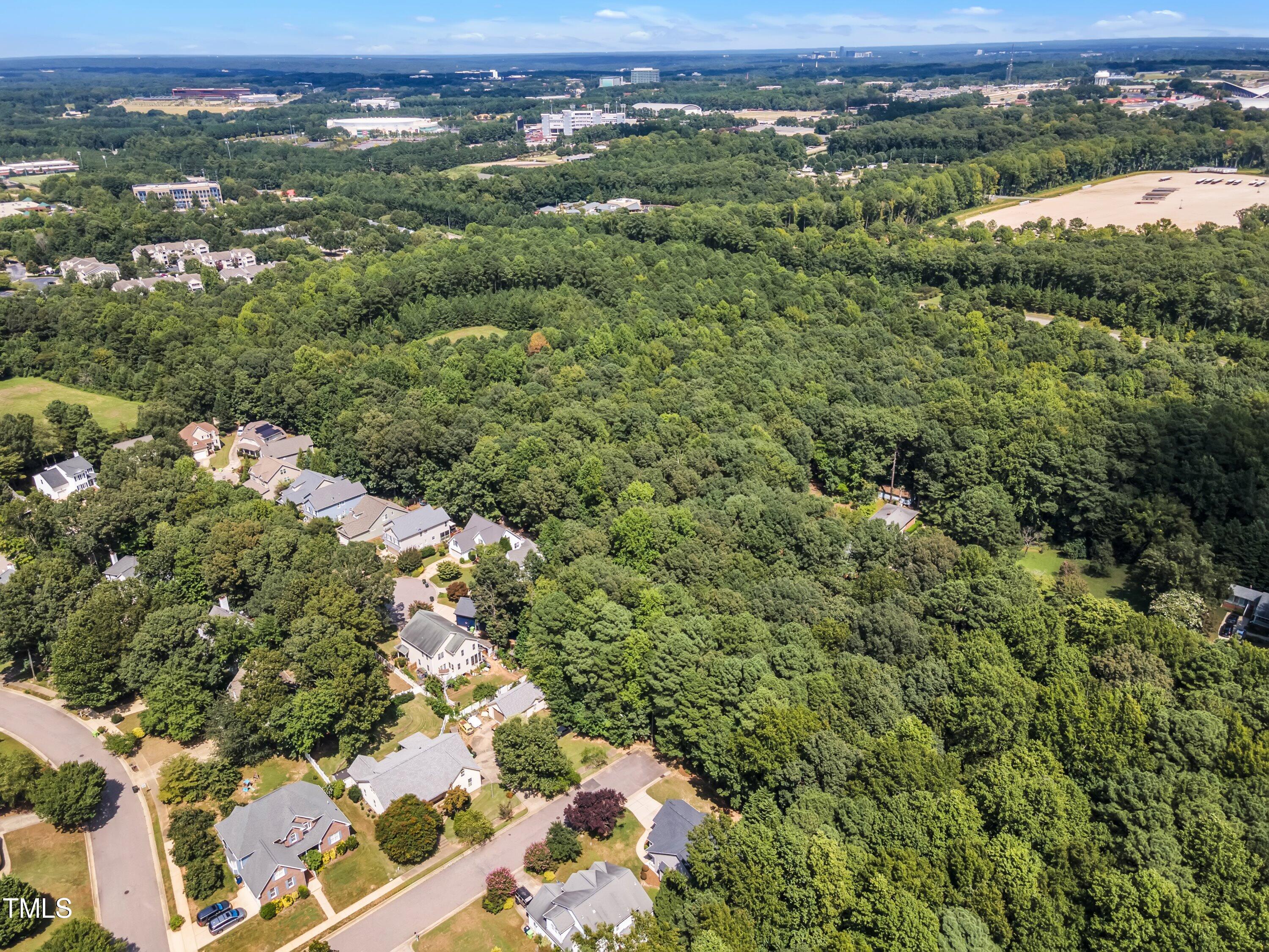 6323 Cedar Waters Drive Raleigh, NC 27607 - Photo 80 of 84 an aerial view of a houses with a yard