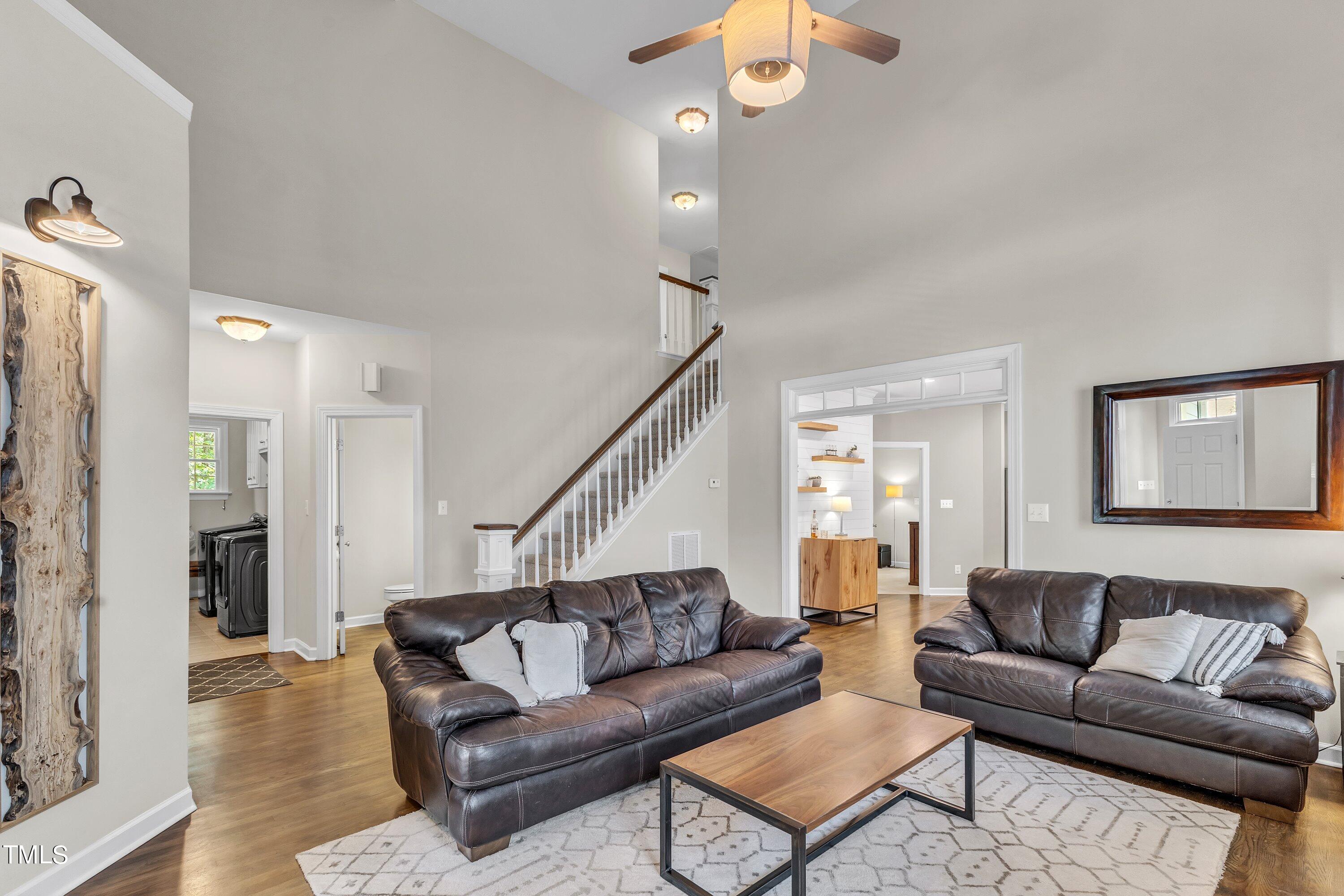 6323 Cedar Waters Drive Raleigh, NC 27607 - Photo 8 of 84 a living room with furniture and a ceiling fan
