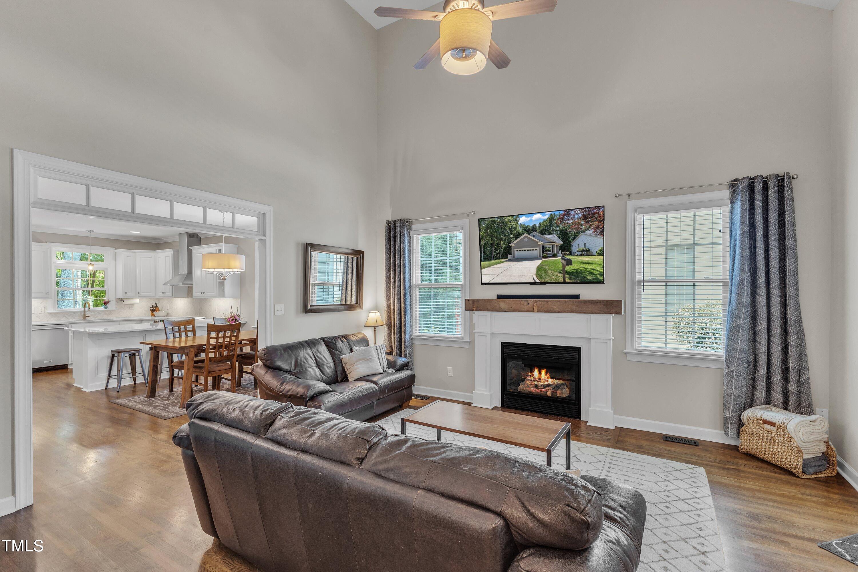 6323 Cedar Waters Drive Raleigh, NC 27607 - Photo 9 of 84 a living room with furniture and a fireplace