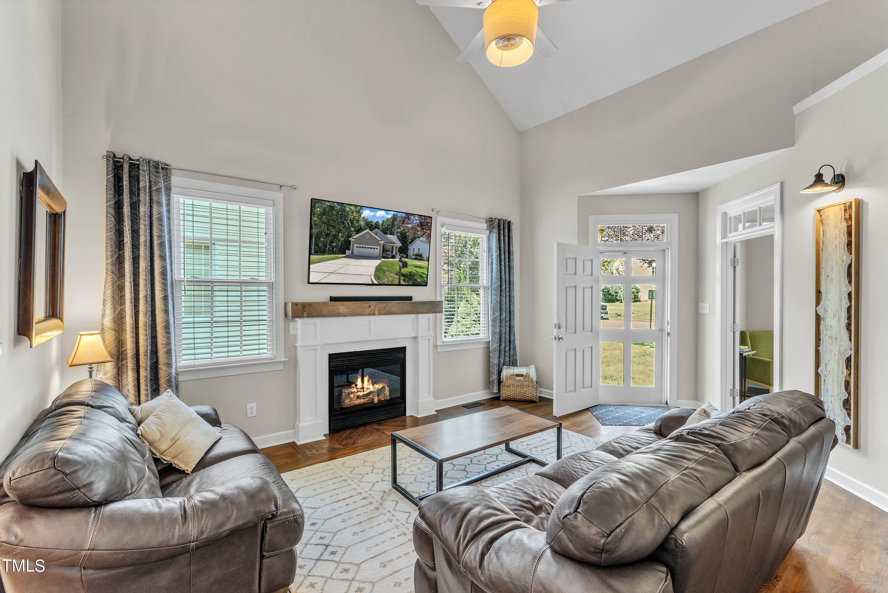 6323 Cedar Waters Drive Raleigh, NC 27607 - Photo 10 of 84 a living room with furniture and a fireplace
