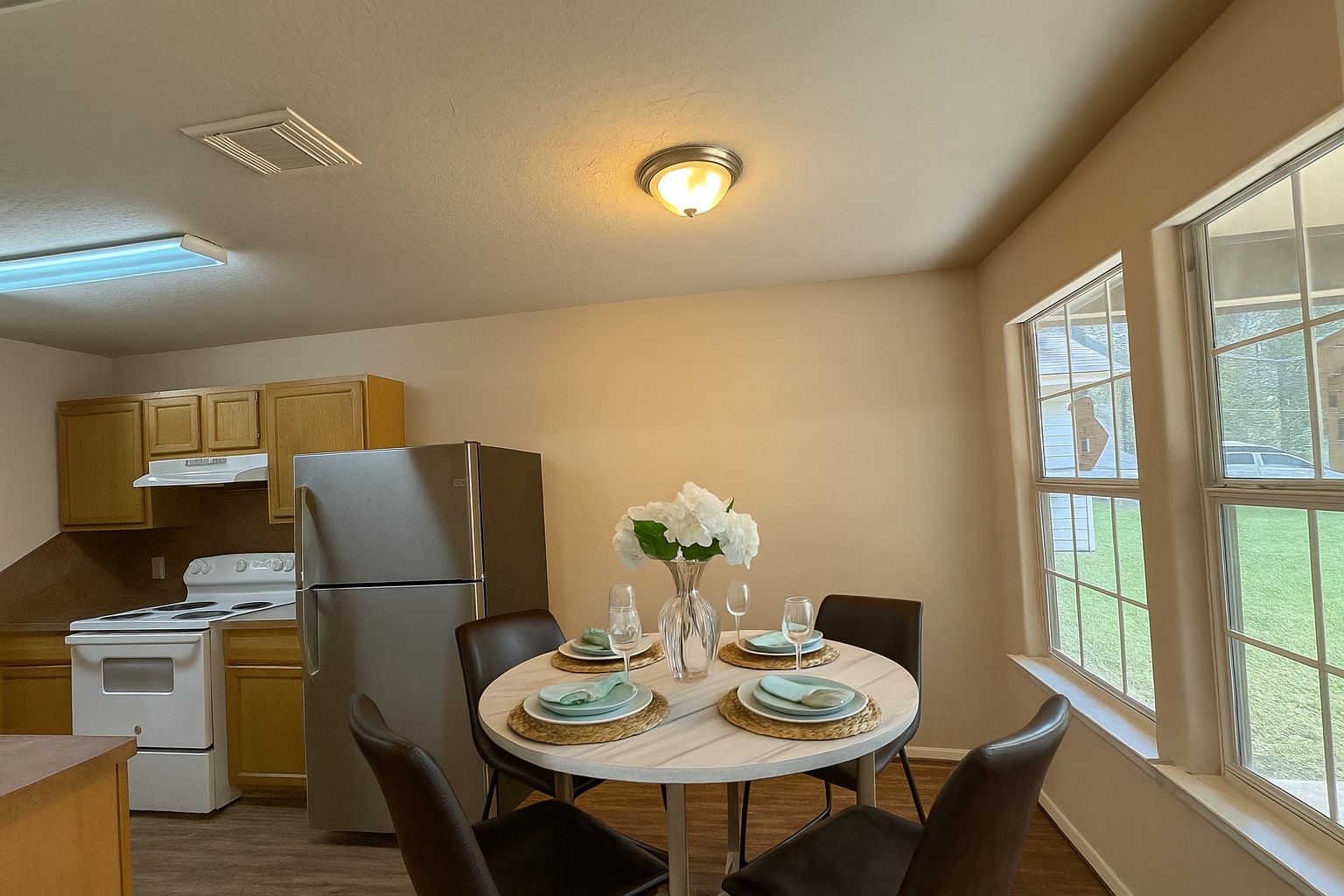 12595 Royal Springs Road Conroe, TX 77303 - Photo 11 of 26 a view of a dining room with furniture a chandelier and wooden floor