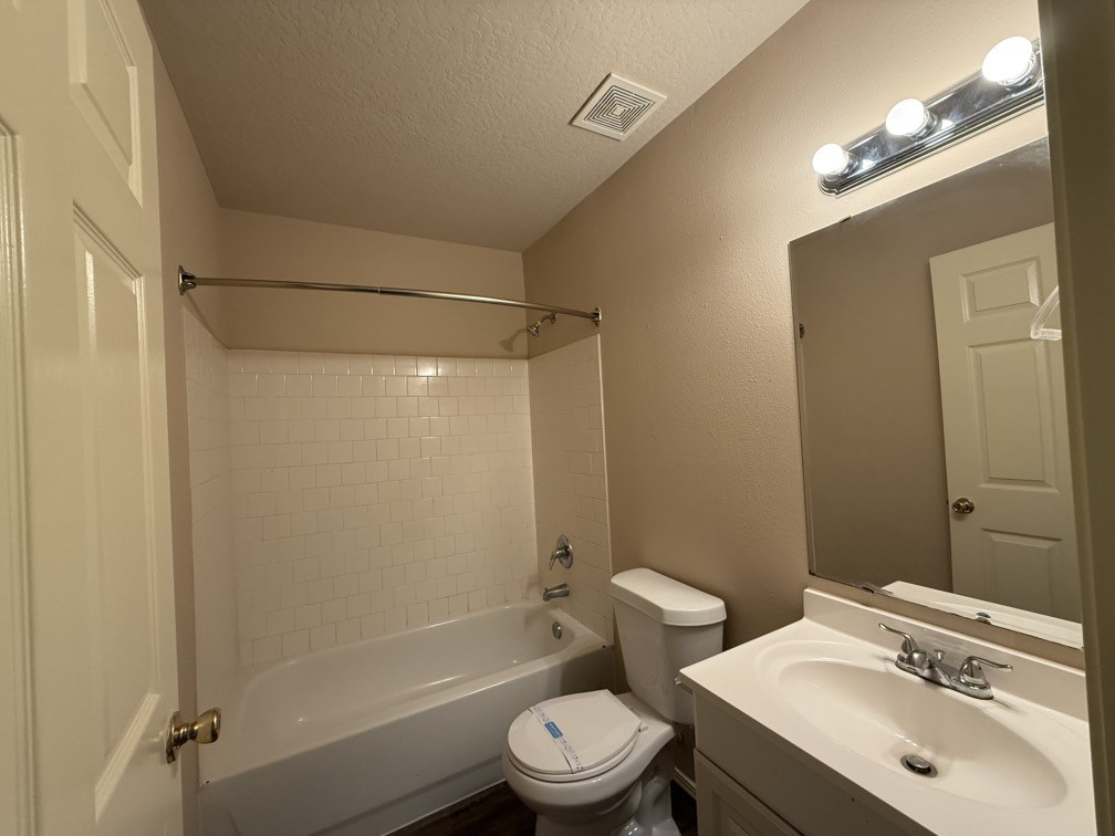 12595 Royal Springs Road Conroe, TX 77303 - Photo 20 of 26 a bathroom with a sink toilet and shower