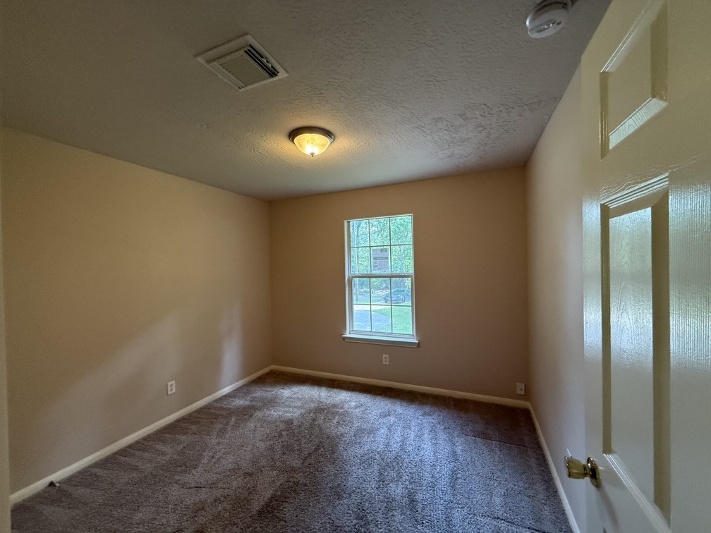 12595 Royal Springs Road Conroe, TX 77303 - Photo 24 of 26 a view of an empty room and window
