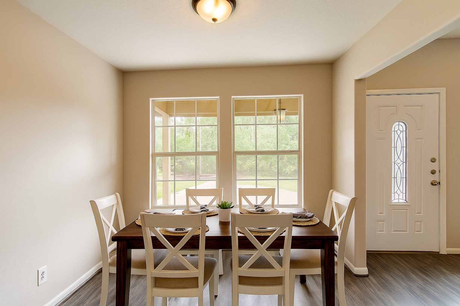 12595 Royal Springs Road Conroe, TX 77303 - Photo 9 of 26 a view of a dining room with furniture and wooden floor