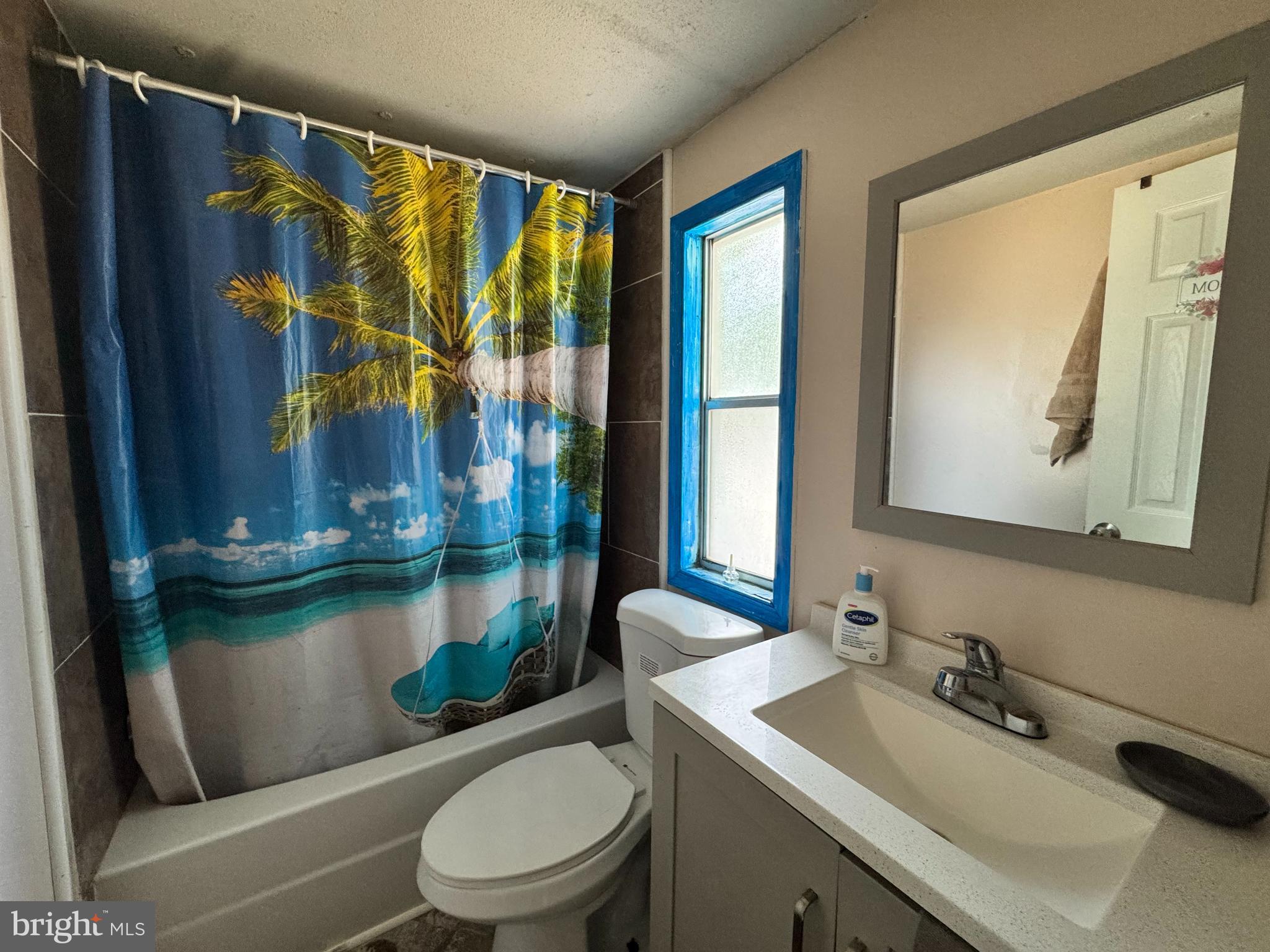 229 Sand Castle Boulevard Fruitland, MD 21826 - Photo 21 of 27 a bathroom with a granite countertop sink a toilet and shower