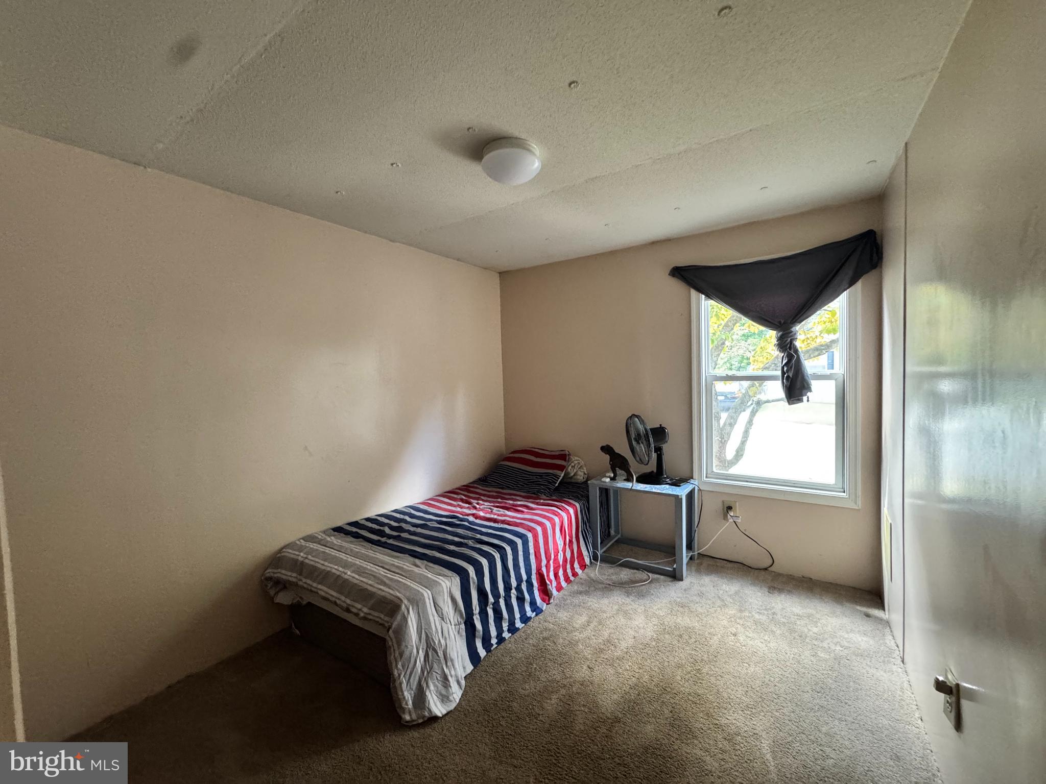 229 Sand Castle Boulevard Fruitland, MD 21826 - Photo 22 of 27 a bedroom with a bed and a window
