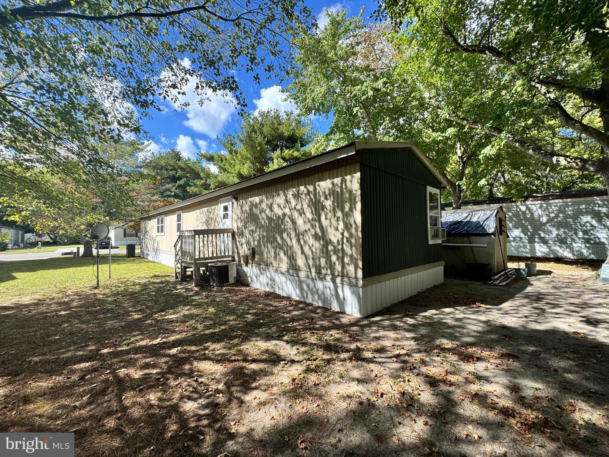 229 Sand Castle Boulevard Fruitland, MD 21826 - Photo 26 of 27 a view of a couches under an umbrella