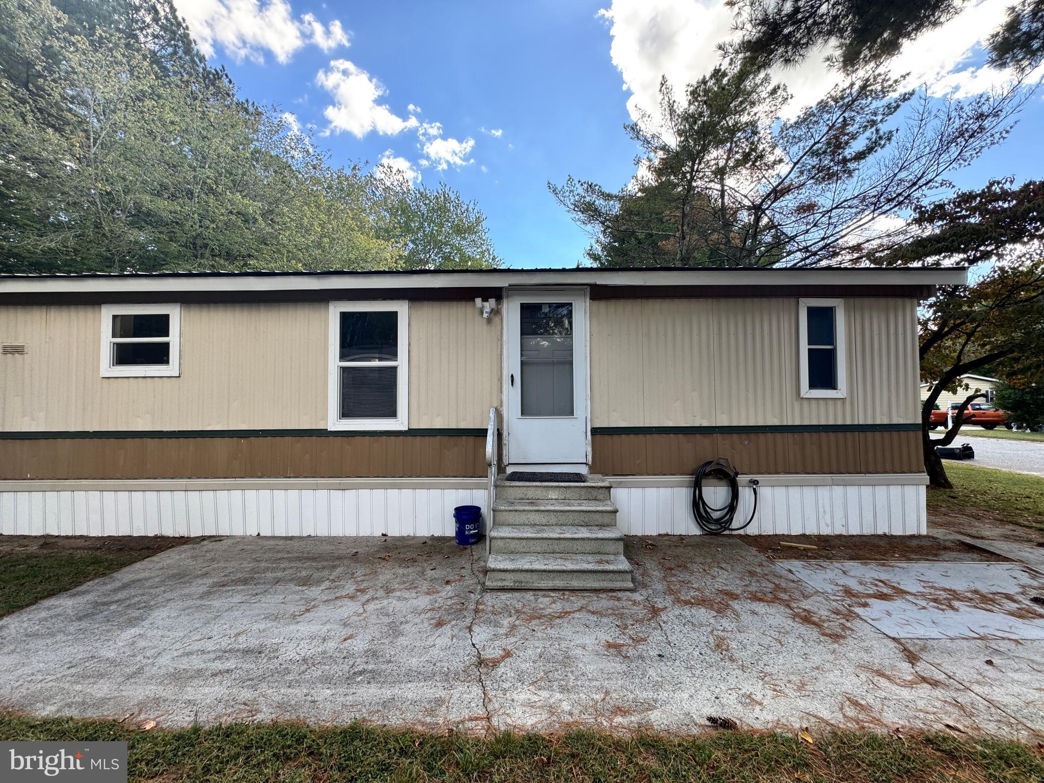 229 Sand Castle Boulevard Fruitland, MD 21826 - Photo 4 of 27 a view of a house with a yard and a tree