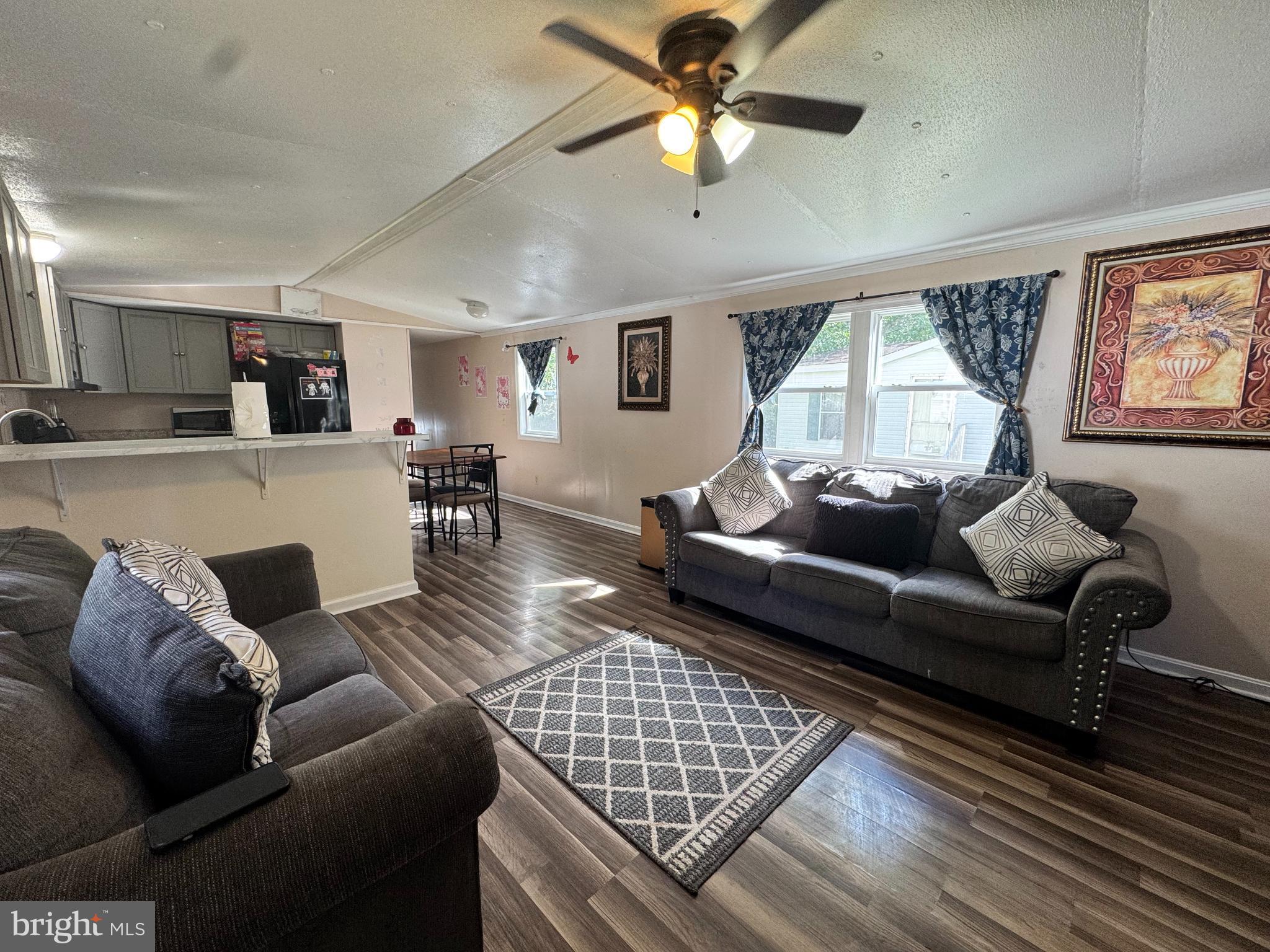 229 Sand Castle Boulevard Fruitland, MD 21826 - Photo 7 of 27 a living room with furniture and a window