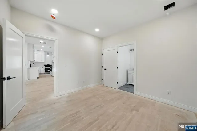 a bathroom with a granite countertop toilet a sink and a bathtub