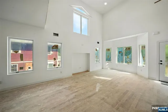 a view of an empty room with windows