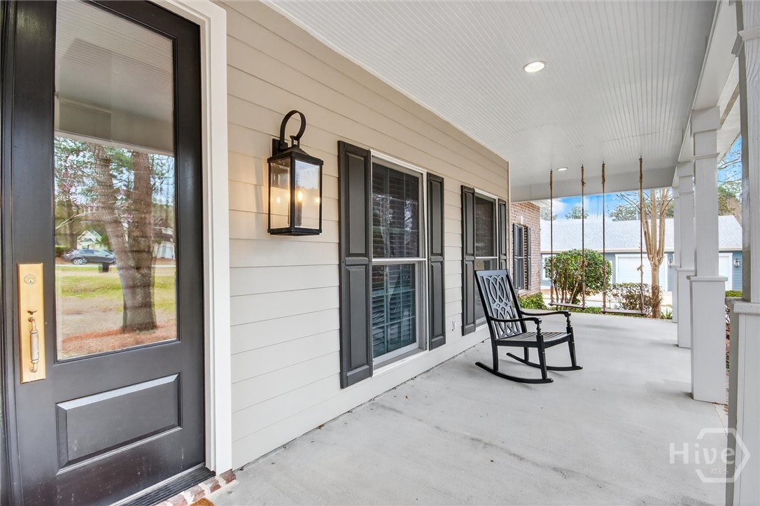 Front porch with 2 individual swings on right front
