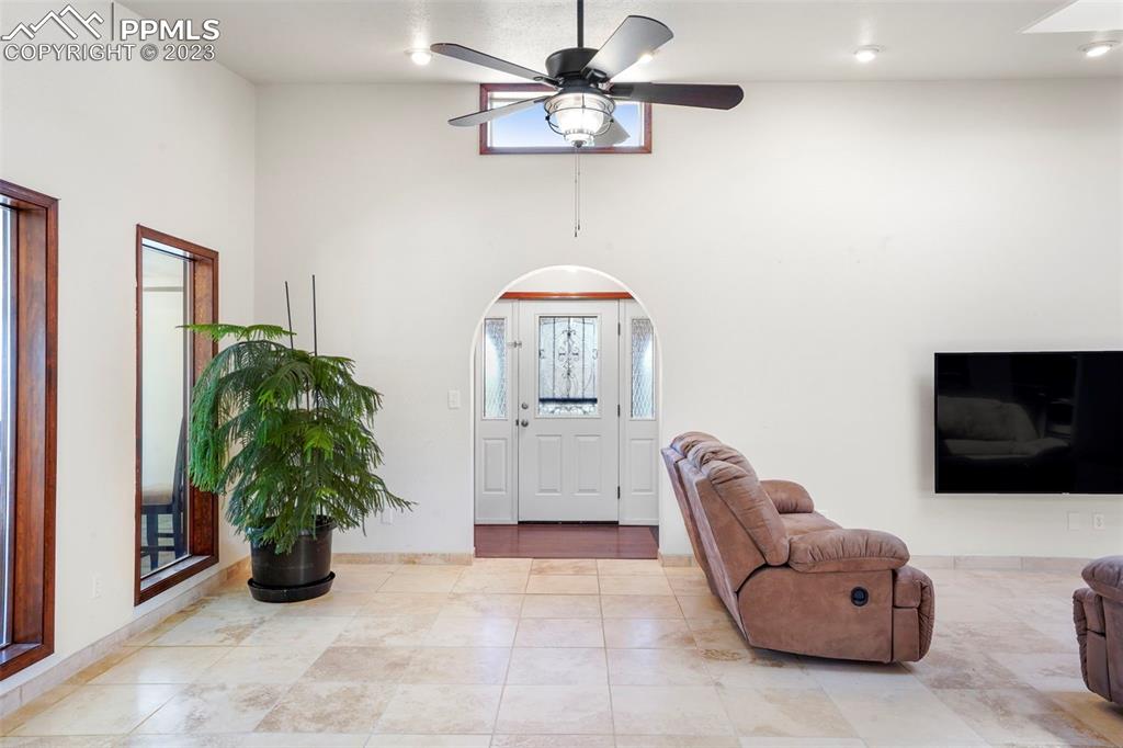 24725 Speer Road Calhan, CO 80808 - Photo 11 of 48 a living room with furniture and a flat screen tv