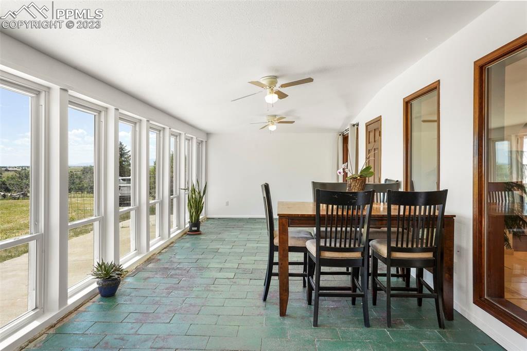 24725 Speer Road Calhan, CO 80808 - Photo 14 of 48 a view of a dining room with furniture window and outside view