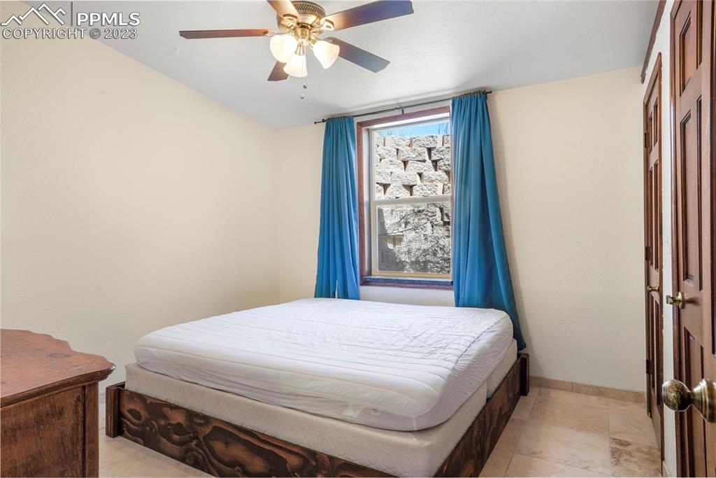 24725 Speer Road Calhan, CO 80808 - Photo 17 of 48 a bedroom with a bed and a window