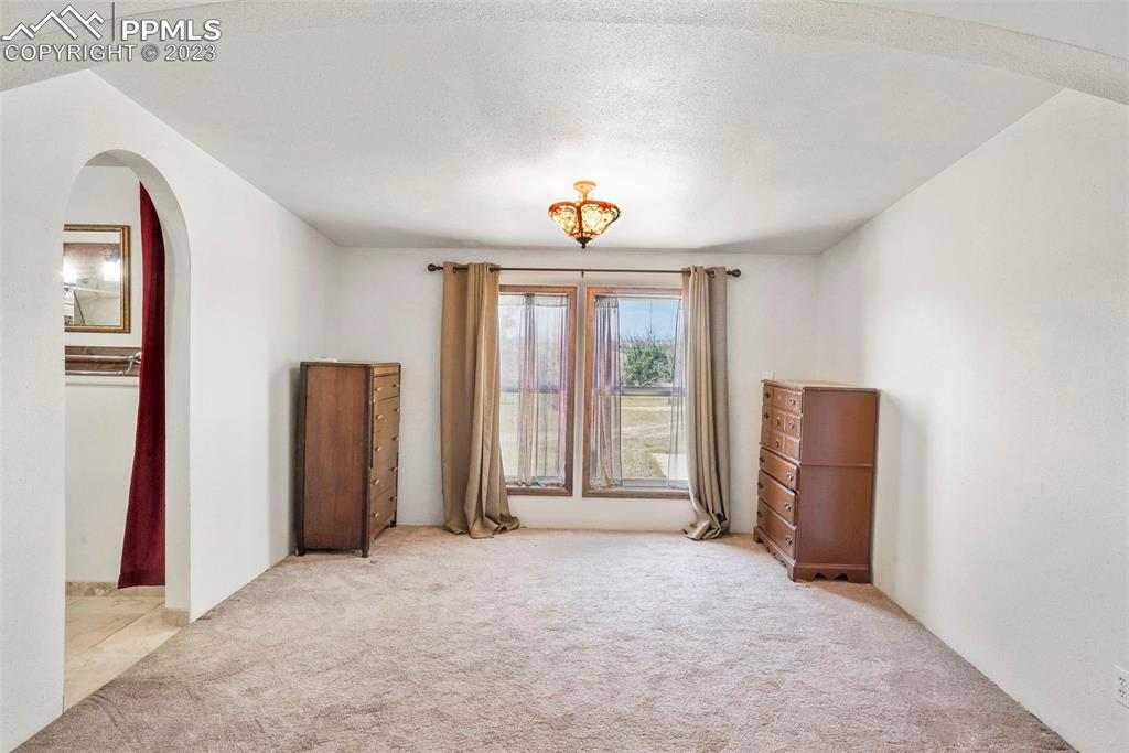 24725 Speer Road Calhan, CO 80808 - Photo 23 of 48 an empty room with windows and closet
