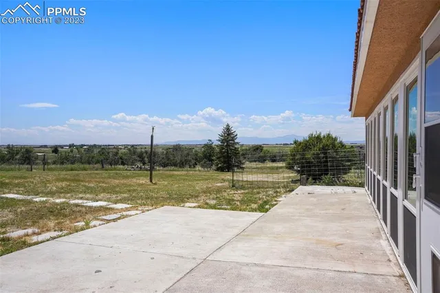 a view of a terrace with a lake view