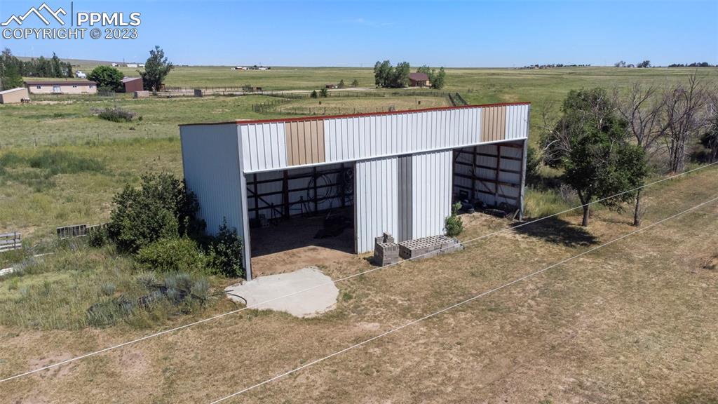 24725 Speer Road Calhan, CO 80808 - Photo 41 of 48 a view of a house with a yard