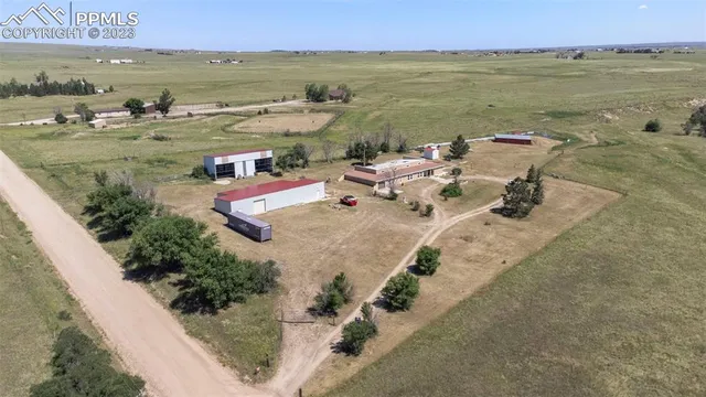 a view of a lake with couches and city view