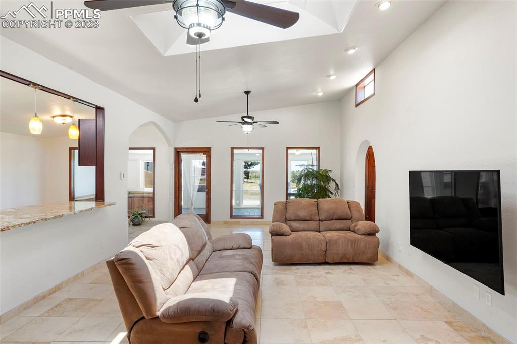 24725 Speer Road Calhan, CO 80808 - Photo 10 of 48 a living room with furniture and a flat screen tv
