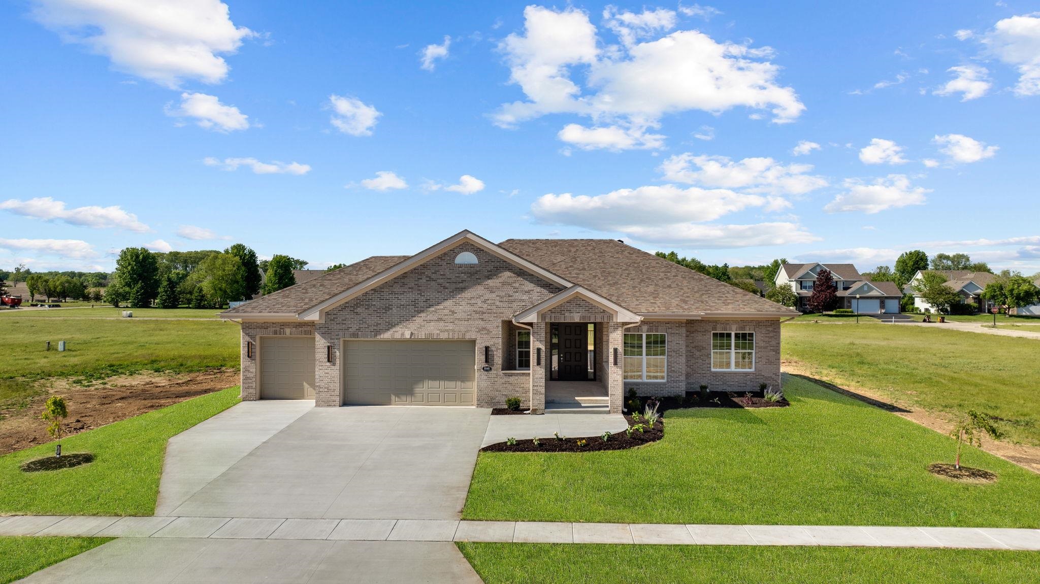 5145 Sycamore Ridge Road Belvidere, IL 61008 - Photo 55 of 57 a front view of a house with a garden