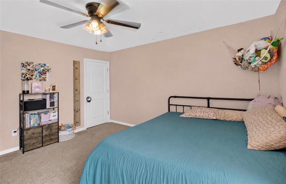 213 Millhone Way Pendleton, SC 29670 - Photo 16 of 25 A comforting bedroom space, featuring a classic ceiling fan for optimal airflow.