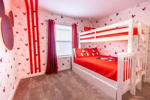 a bed room with a bed and a window