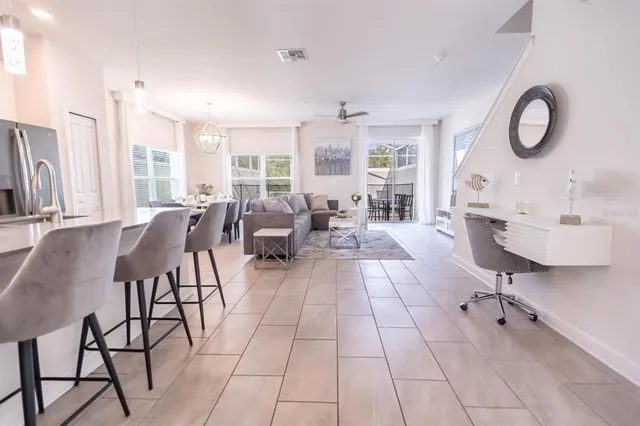 a living room with patio bathtub and a large window