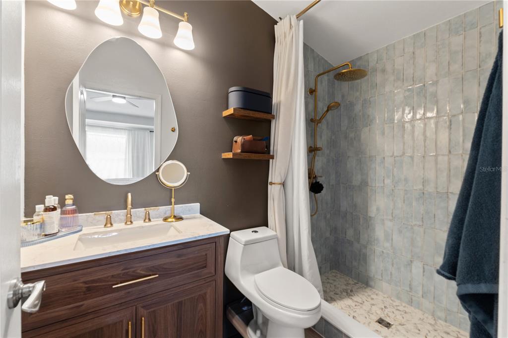 12310 Boot Spur Way Spring Hill, FL 34610 - Photo 14 of 36 a bathroom with a sink toilet and shower