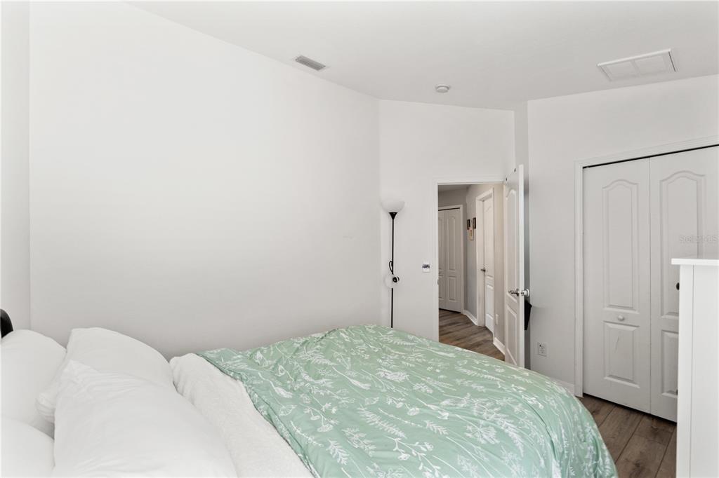 12310 Boot Spur Way Spring Hill, FL 34610 - Photo 24 of 36 a bedroom with a bed and a closet