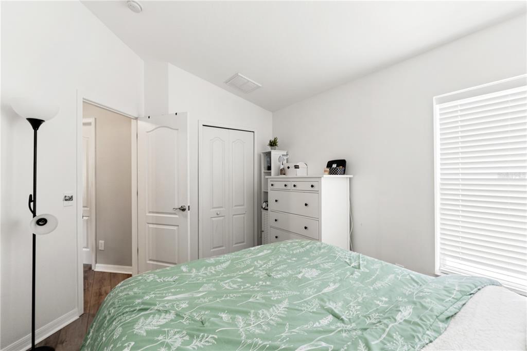 12310 Boot Spur Way Spring Hill, FL 34610 - Photo 25 of 36 a bedroom with a bed and cabinets