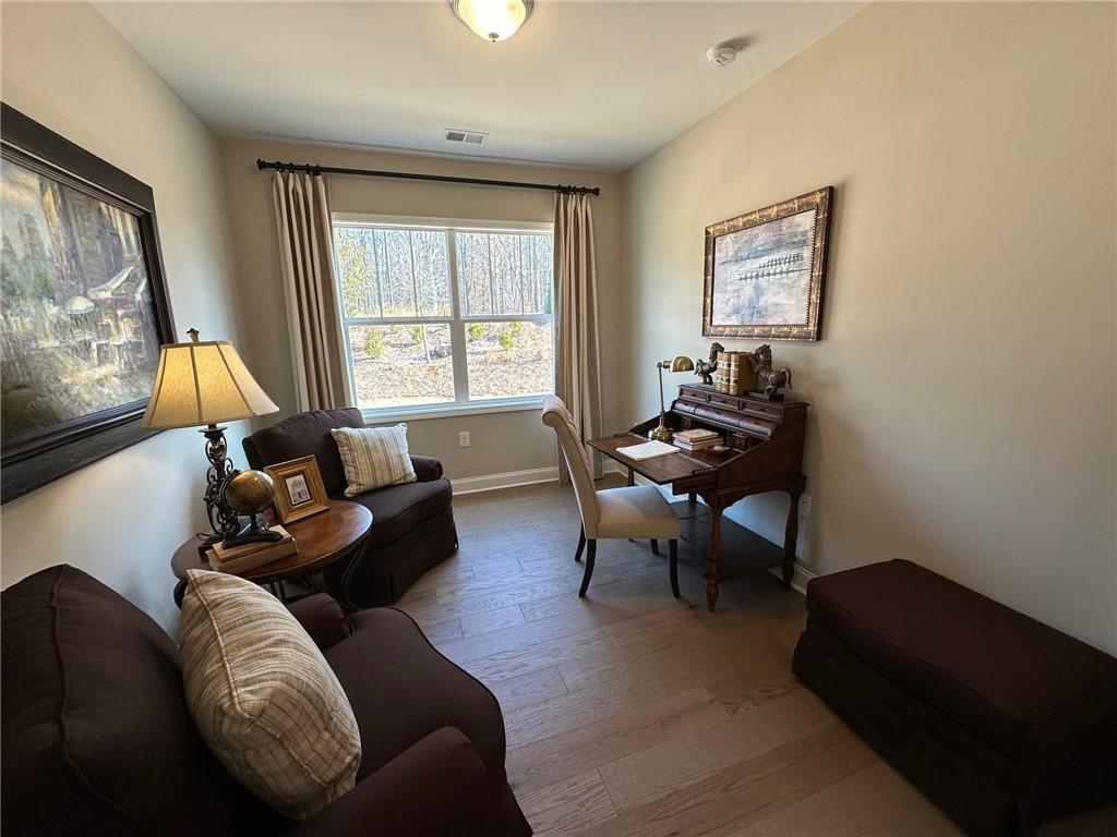 1001 Calypso Way, Unit 1001 Cumming, GA 30040 - Photo 15 of 27 a living room with furniture and a window